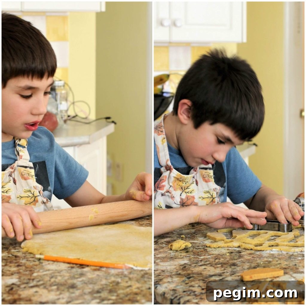 Eric rolling and cutting out the dog biscuit dough