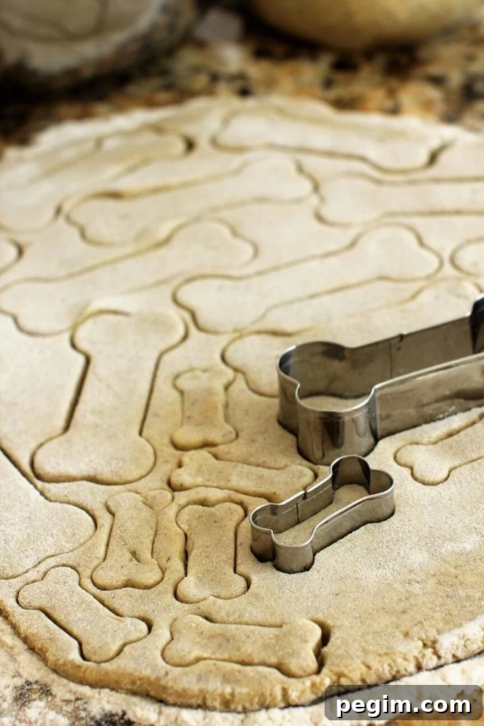 Cutting out bone shaped doggie biscuits