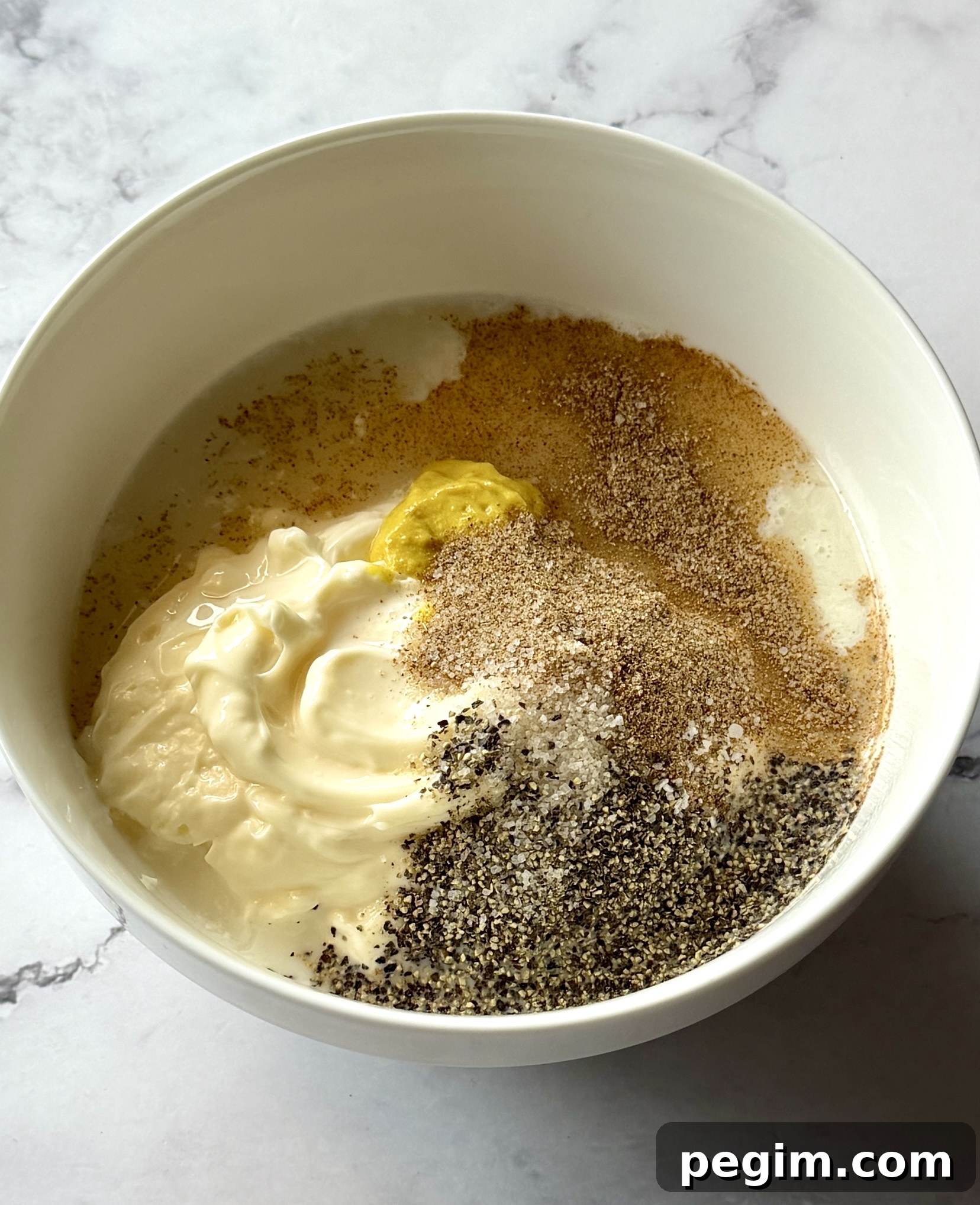 Dressing ingredients in a bowl. 