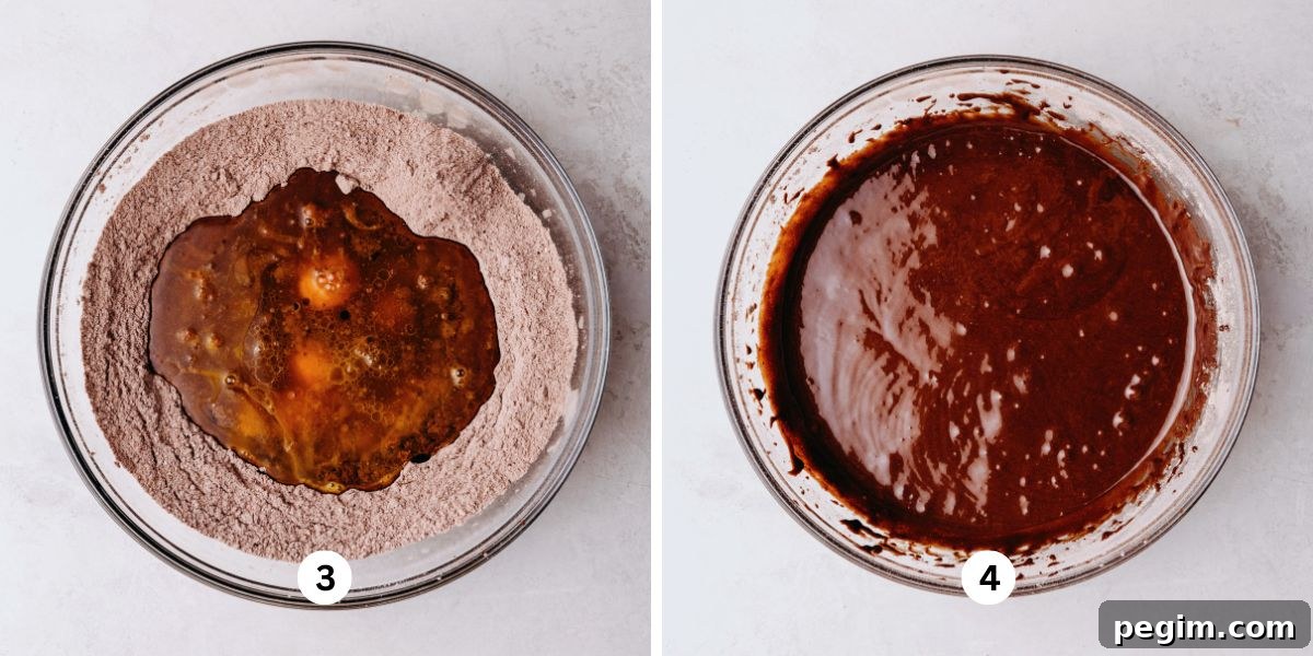 Wet ingredients added to the center well of dry ingredients in a glass bowl and a fully mixed bowl of chocolate chiffon cake batter in a glass bowl on a white marbled background.