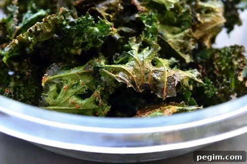 A closeup of a bowl of homemade Baked Kale Chips 
