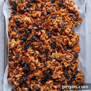 An overhead shot of a tray of chocolate cherry paleo granola