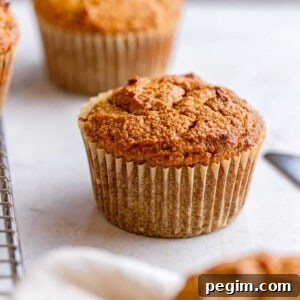 Three gluten free pumpkin muffins made with almond flour