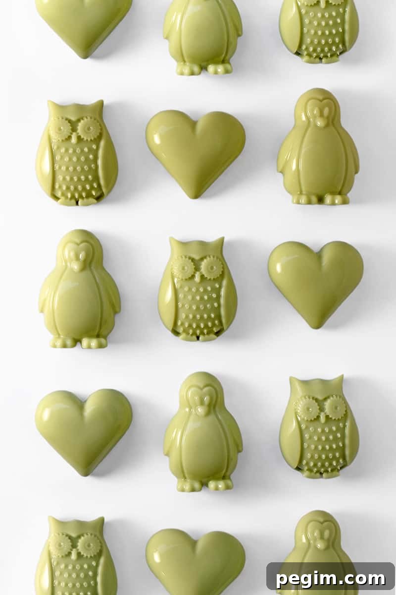 heart and owl-shaped Matcha Coconut Gummies on a white background