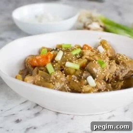 Slow cooker Korean chicken in a white bowl