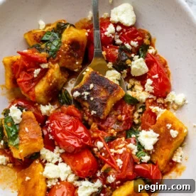 Pan-fried gnocchi in cherry tomato basil sauce with feta cheese