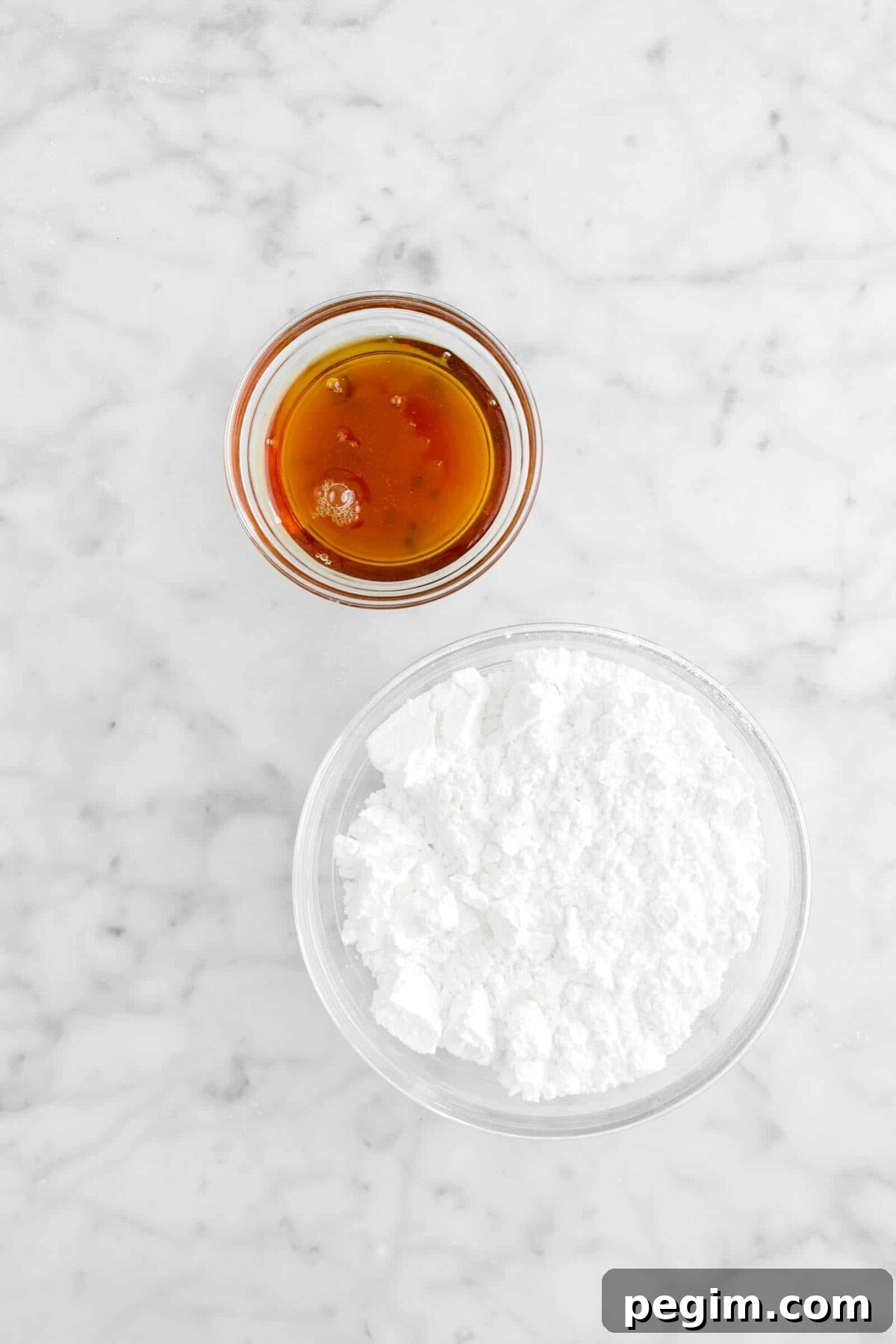 maple syrup and powdered sugar in glass bowls