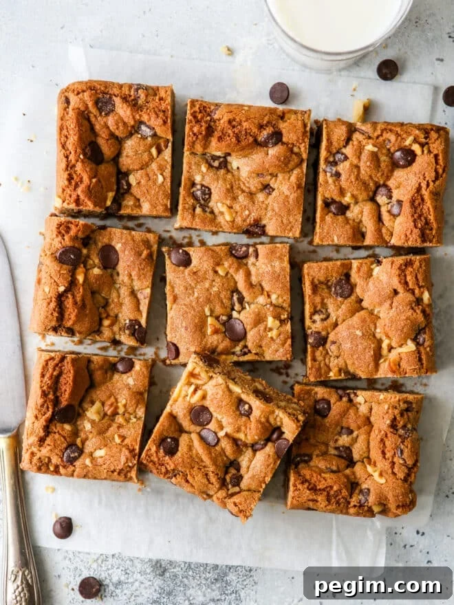 sliced whole wheat chocolate chip cookie bars with glass of milk 