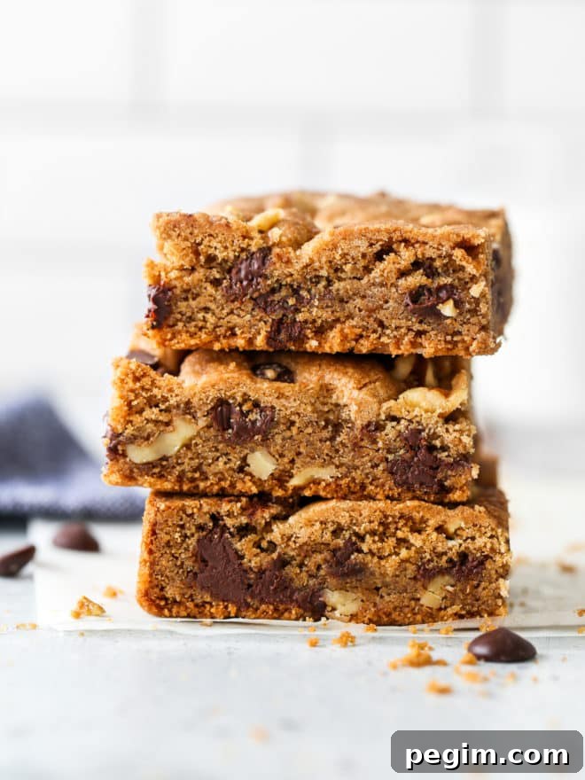 baked whole wheat chocolate chip cookie bars stacked together