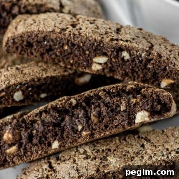 chocolate hazelnut biscotti stacked on white plate
