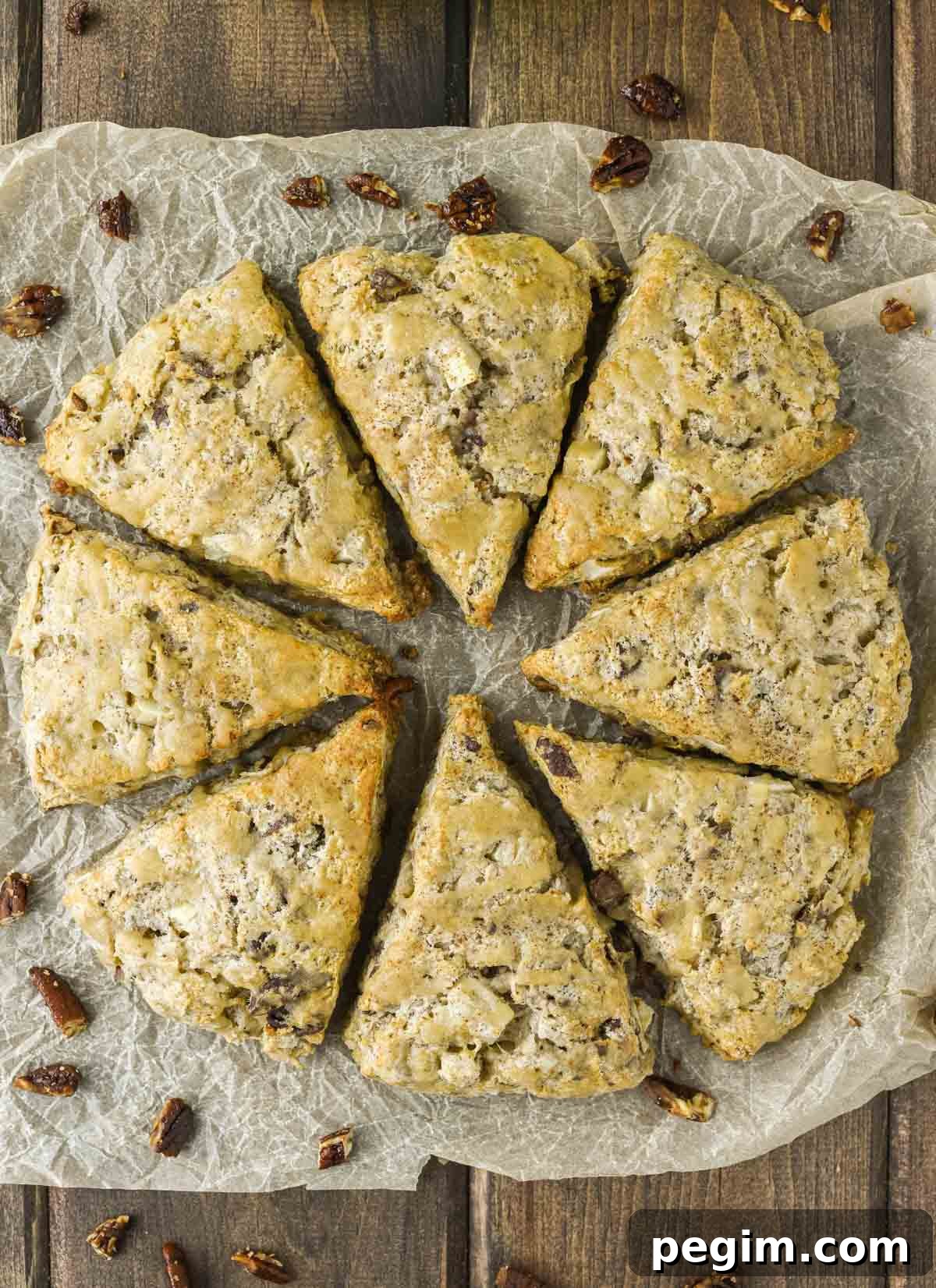 overhead shot of 8 apple scones on parchment paper