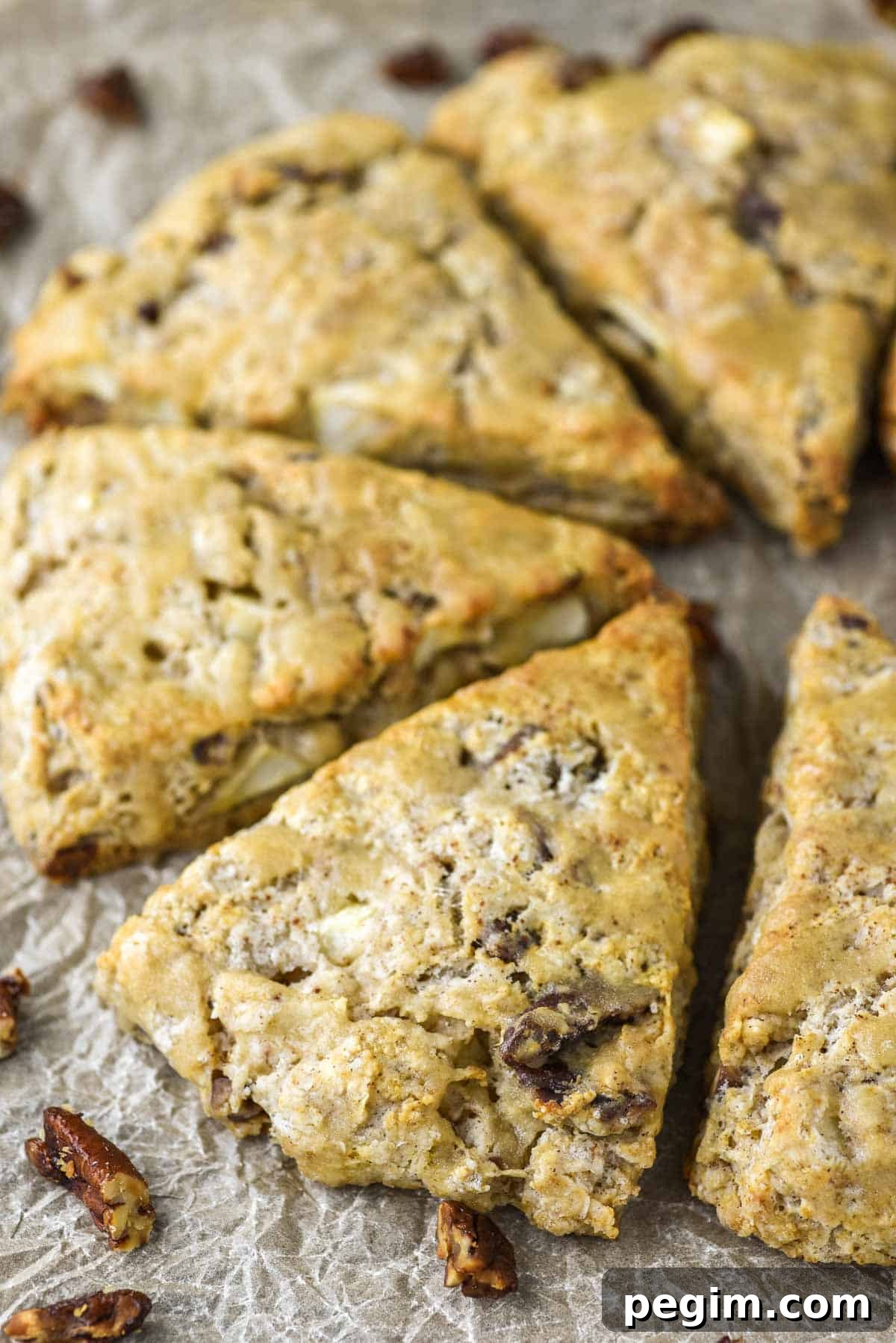 close-up of apple cinnamon scones on parchment paper
