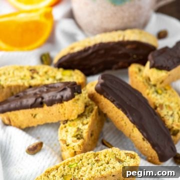 orange pistachio biscotti on dish towel