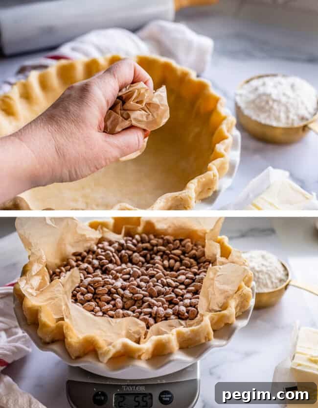 crumpling parchment paper for blind baking pie crust, filling with weights.
