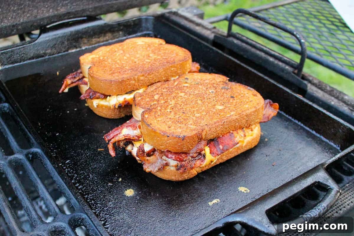 The Chicken Bacon Ranch Patty Melt toasting on the cast iron.