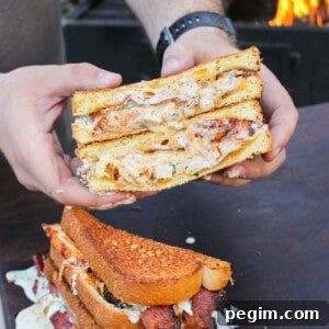 Chicken Bacon Ranch Patty Melt sliced in half so you can see the inside.