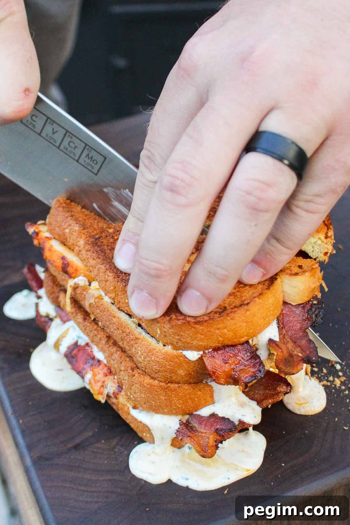 Slicing both the Chicken Bacon Ranch Patty Melt at the same time.