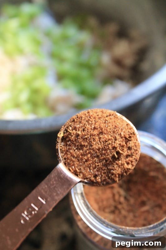 combine canned chicken chunks with cajun seasoning 