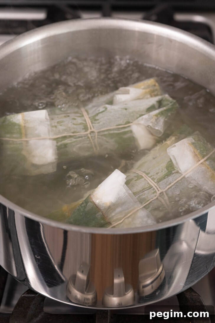 Pasteles boiling in water.