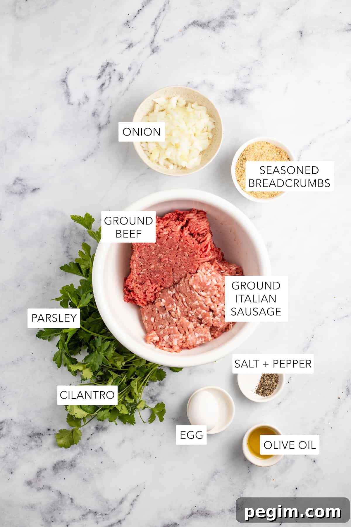 Ingredients for air fryer meatballs labeled and separated into bowls.