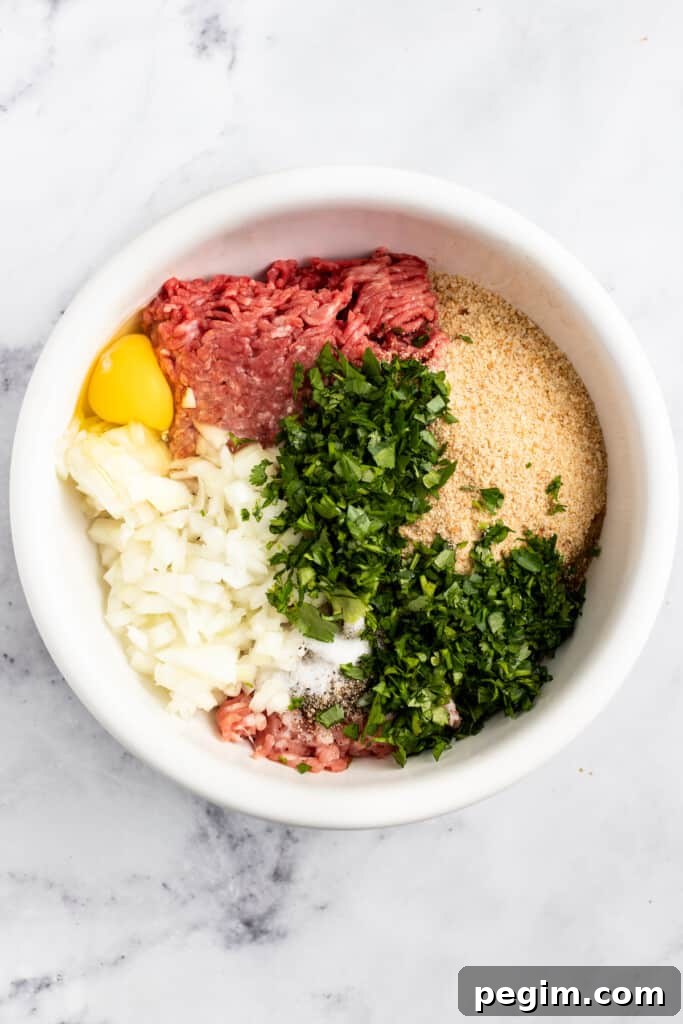 Ingredients for air fryer meatballs in a bowl before being mixed together.