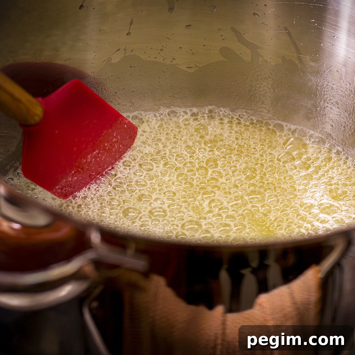 Melted butter simmering in a saucepan and just beginning to brown.