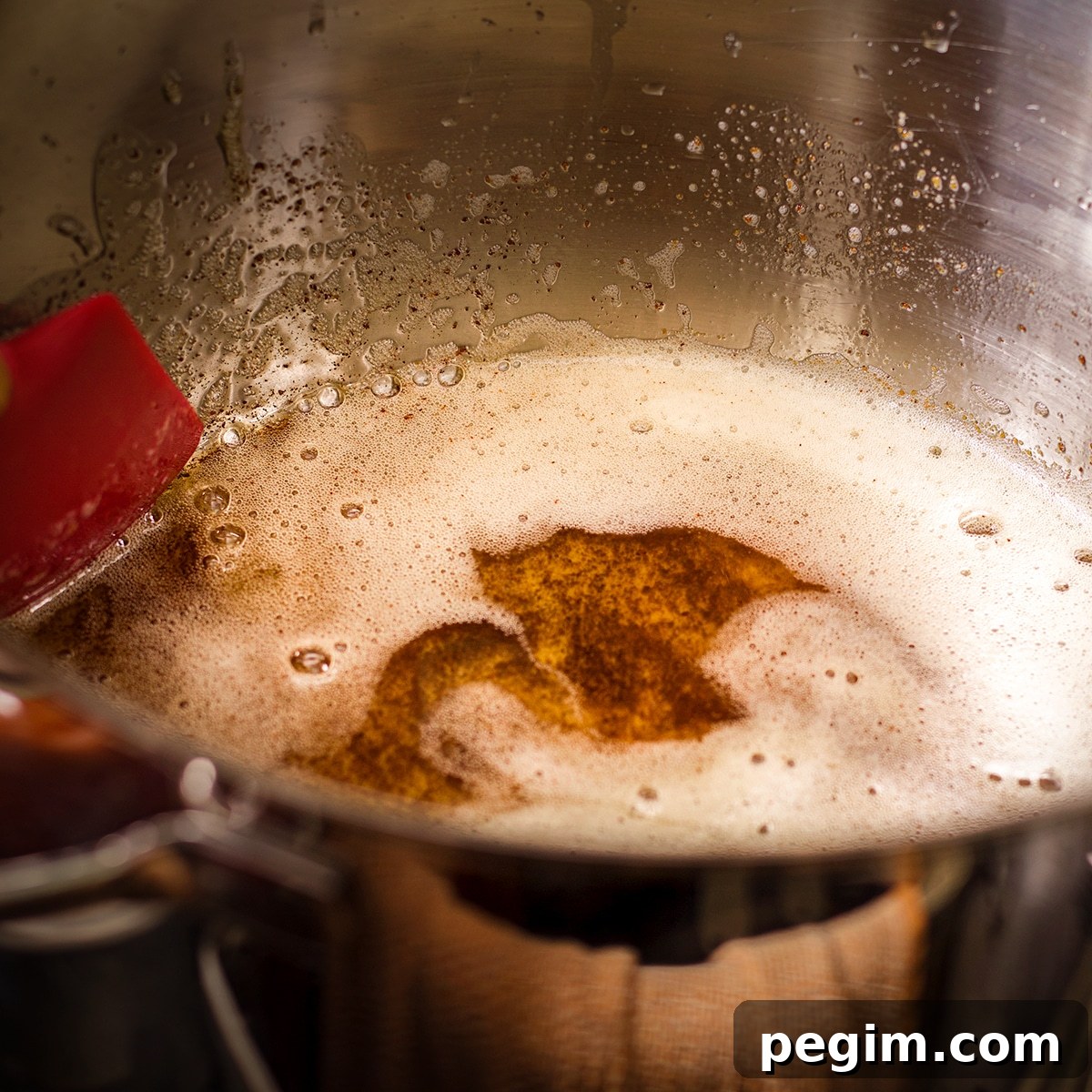 Brown butter simmering in a saucepan.
