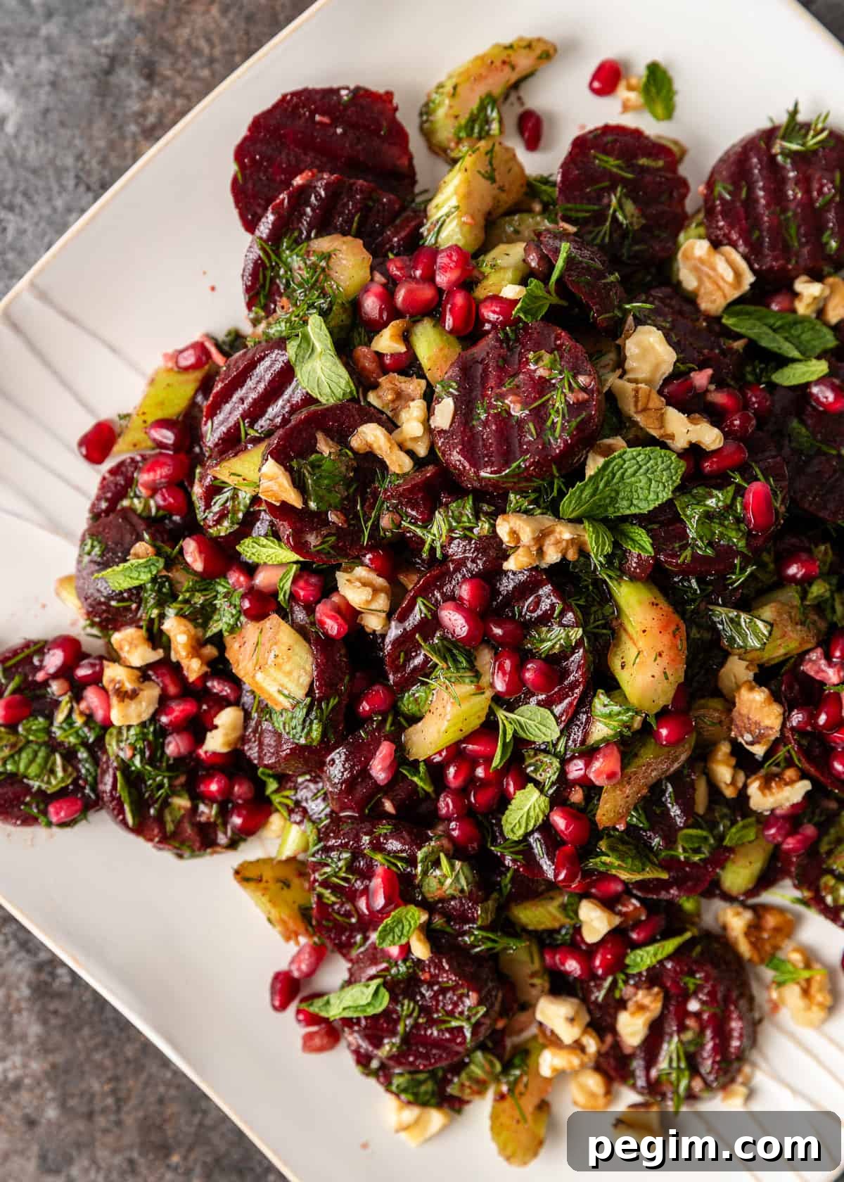 overhead closeup: beet salad on a white plate