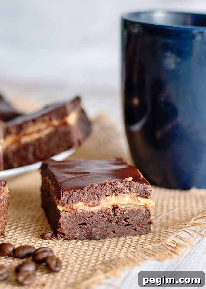 a brownie square on a piece of burlap with a blue mug behind it