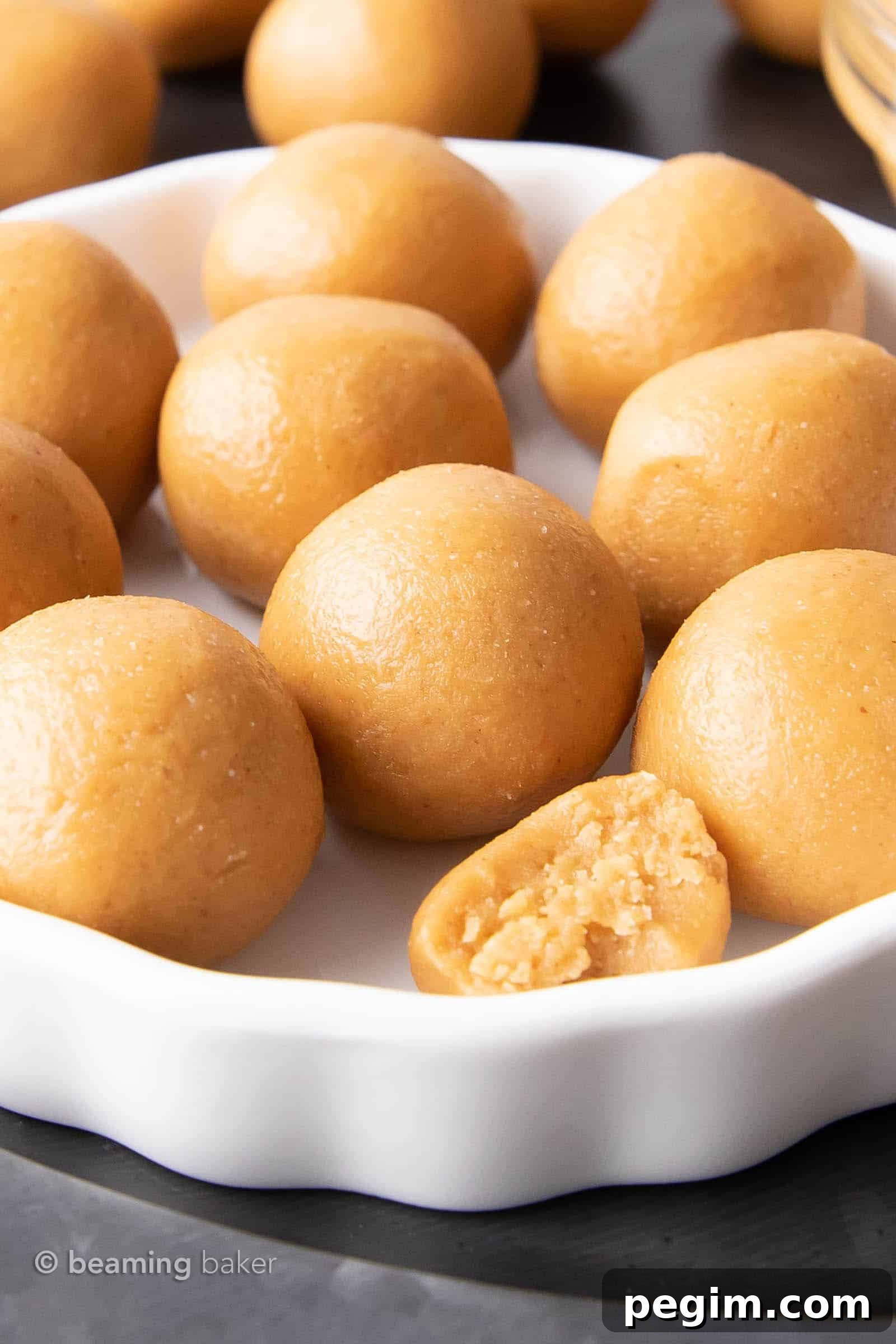 3-Ingredient Keto Peanut Butter Bites — Low-Carb Snack 3 White ceramic serving tray with peanut butter balls spread on top.