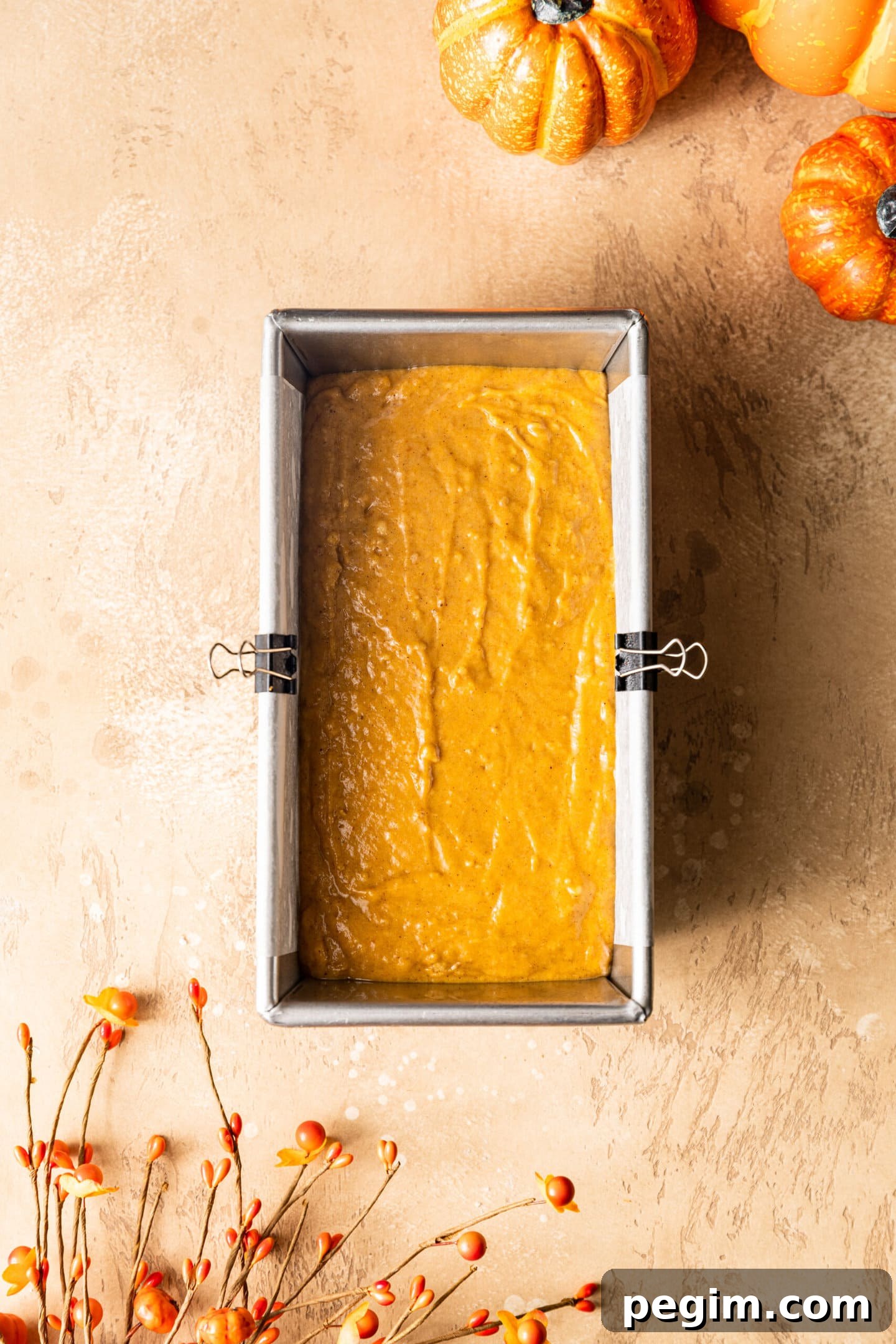 Pumpkin bread batter inside loaf pan