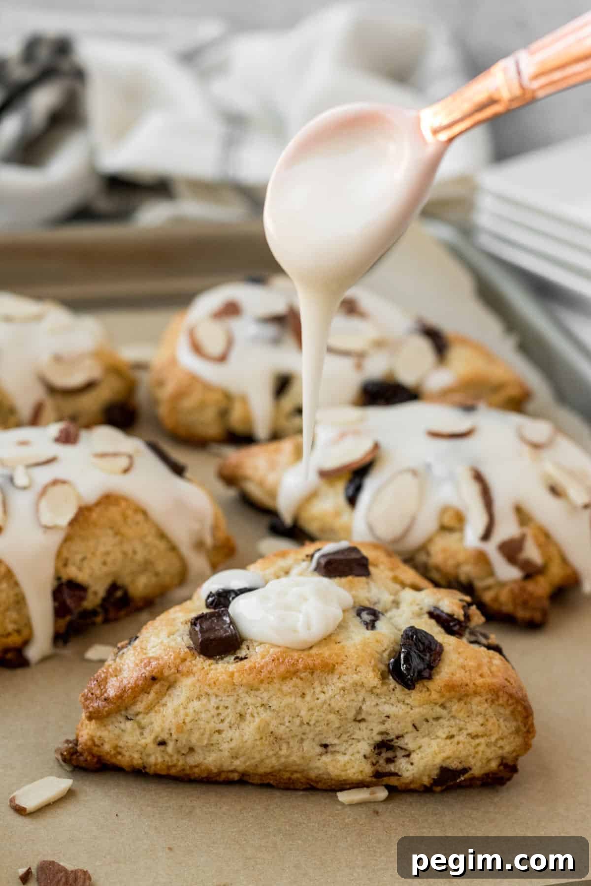 Chocolate Cherry Almond Scones Recipe — Tender, Flaky & Rich 11 drizzling glaze onto scones