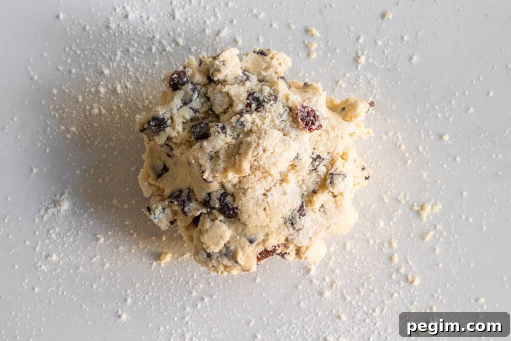 Chocolate Cherry Almond Scones Recipe — Tender, Flaky & Rich 6 mound of unformed scone dough