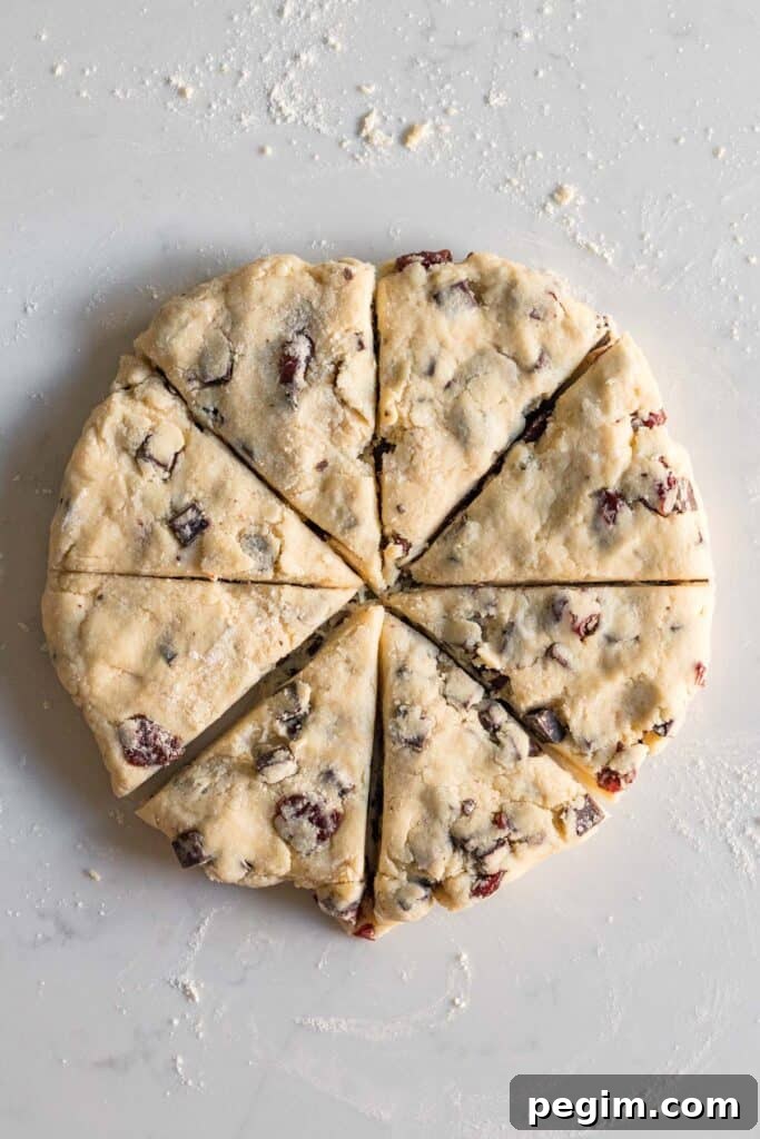 Chocolate Cherry Almond Scones Recipe — Tender, Flaky & Rich 8 scone dough cut into wedges