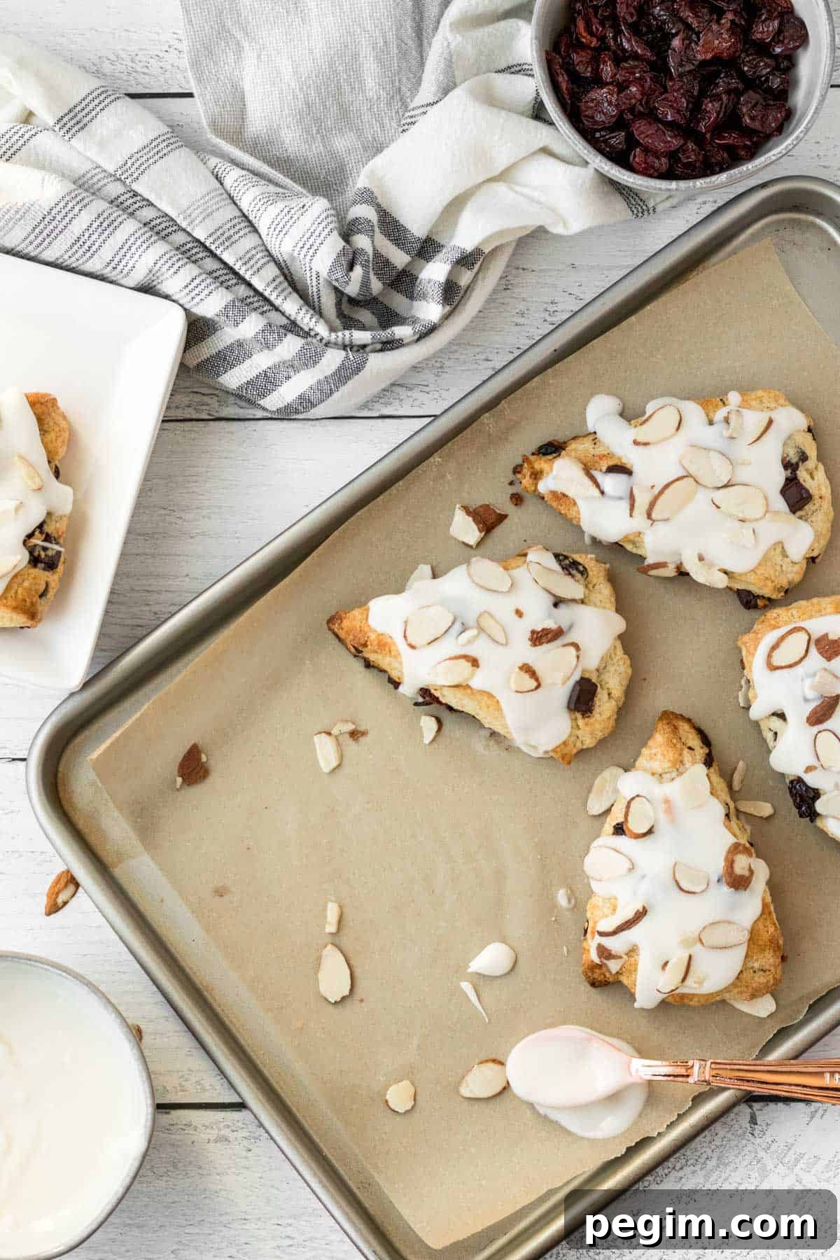 Chocolate Cherry Almond Scones Recipe — Tender, Flaky & Rich 9 chocolate cherry almond scones on a baking sheet