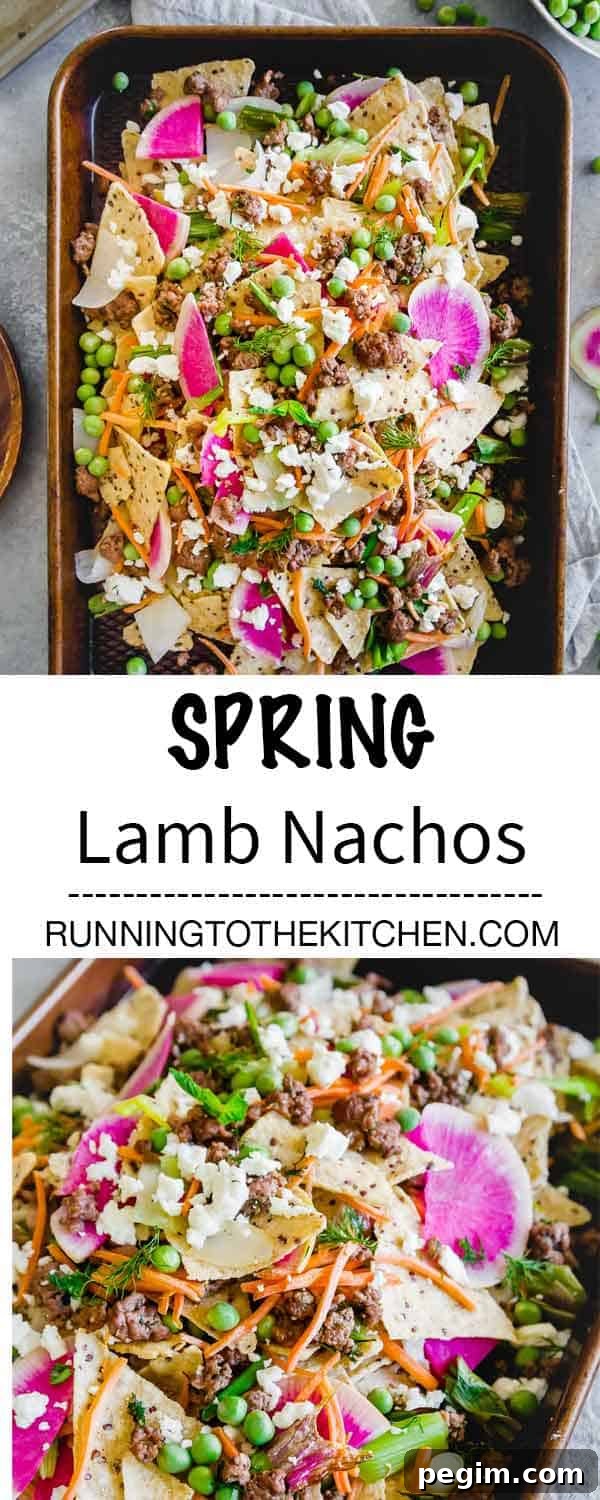 Sheet pan spring nachos with ground lamb, early springs vegetables and lots of feta cheese piled high on tortilla chips.