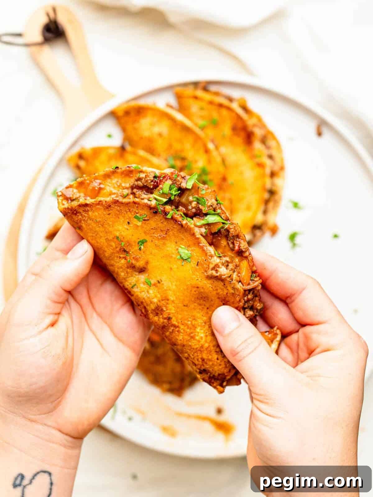 Cheesy Bolognese Birria Tacos in soft white corn tortillas.