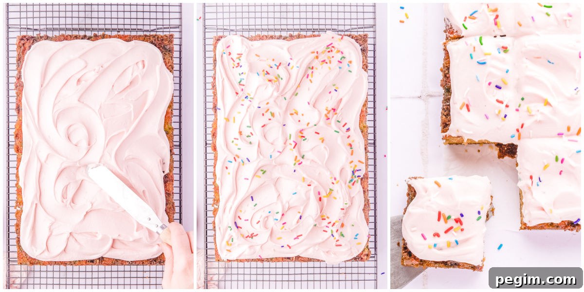 The frosting spread over the funfetti cake and topped with rainbow sprinkles.