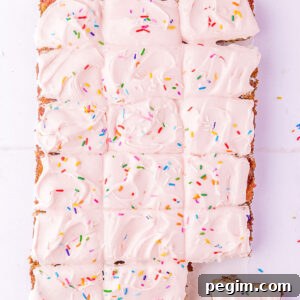 The finished funfetti sheet cake cut into 18 slices.