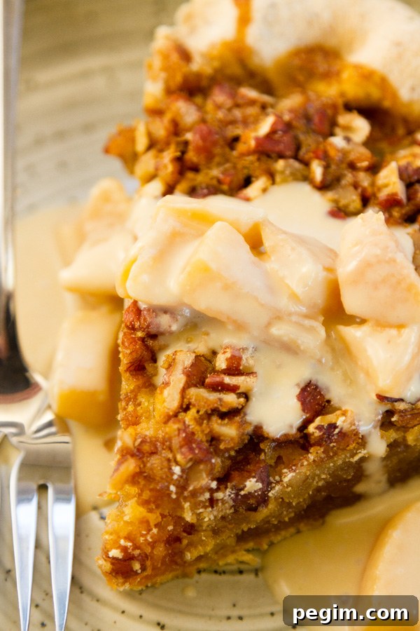 pecan pie with Peach Caramel Cream Sauce over it