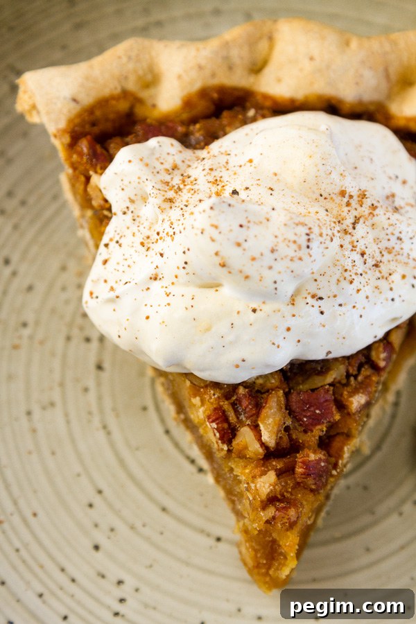 a piece of pecan pie with Peach Caramel Whipped Cream on top