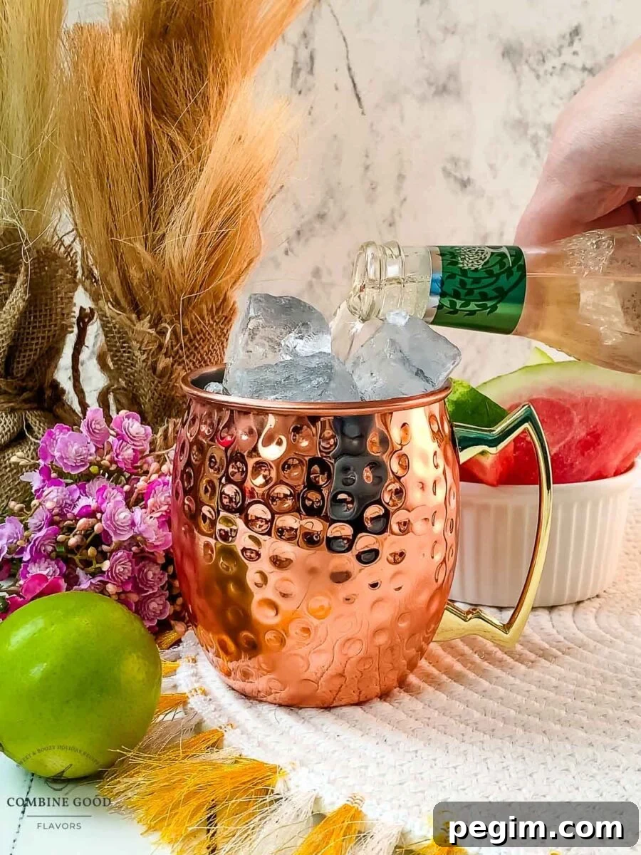 Topping the watermelon mule off with ginger beer.