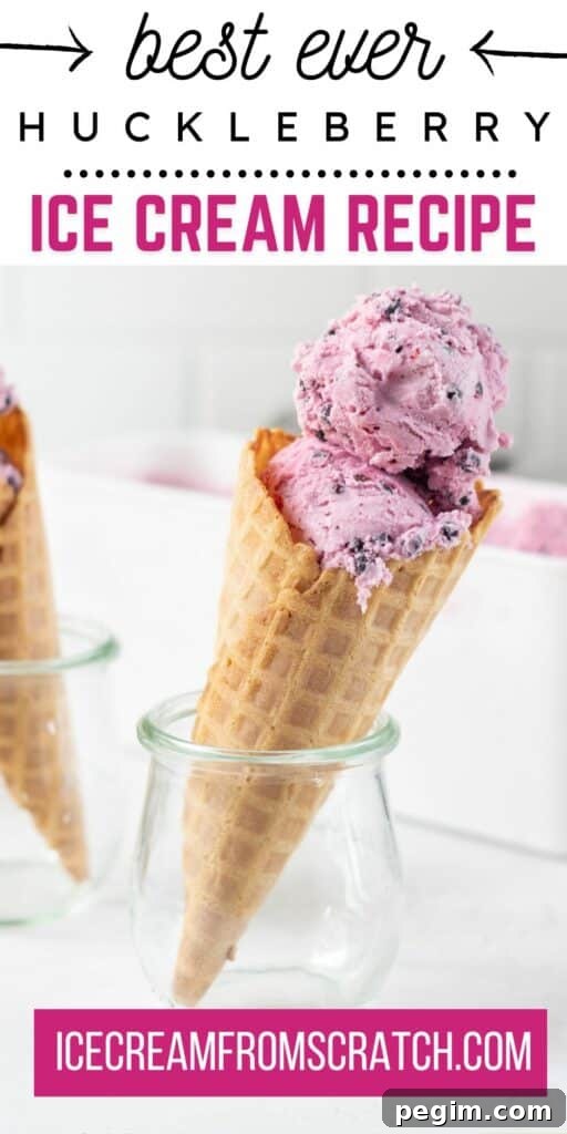 scoops of huckleberry ice cream in a waffle cone propped up in a small jar. Text at top of image says "best ever huckleberry ice cream recipe"