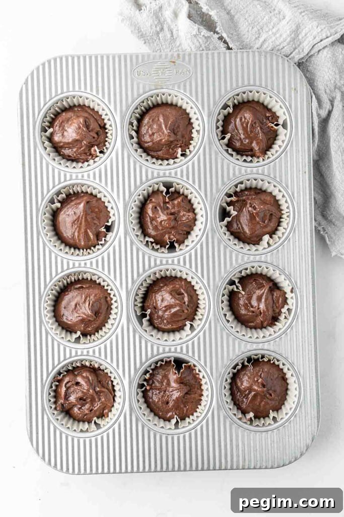 Chocolate cupcake batter in the pan ready to be baked.