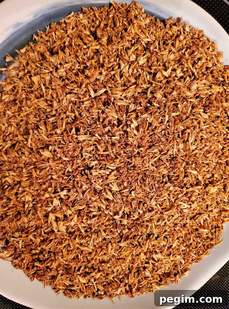 An overhead shot of cracked and dried spent grains from brewing beer.
