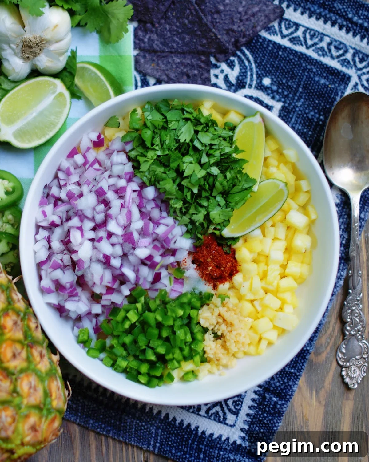 how to make fresh pineapple salsa with diced pineapples, diced onions, diced jalapenos, chopped cilantro and spices