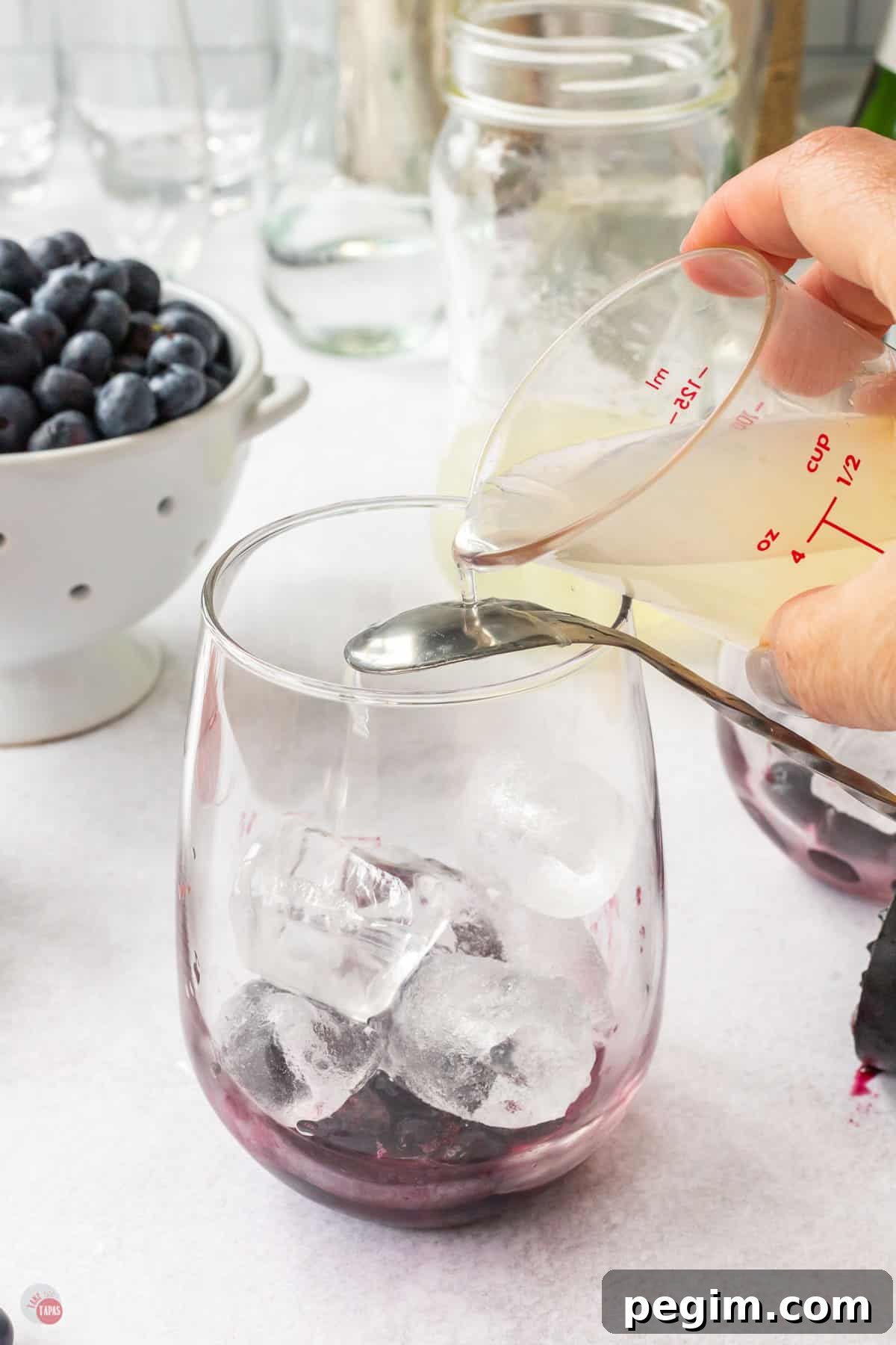 juice pouring over spoon