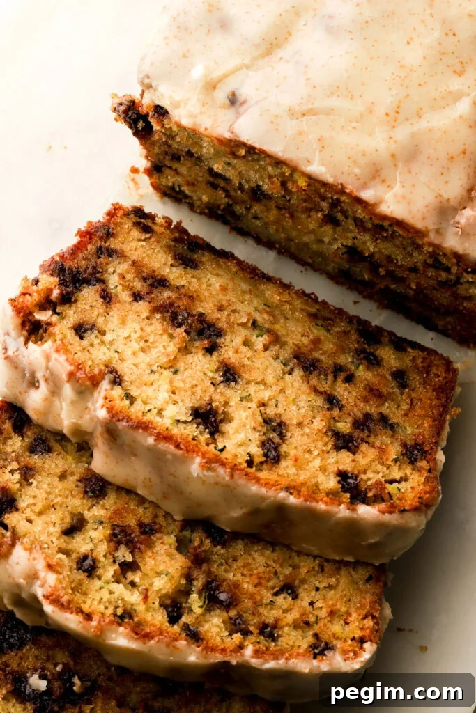 chocolate chip zucchini loaf sliced on a board