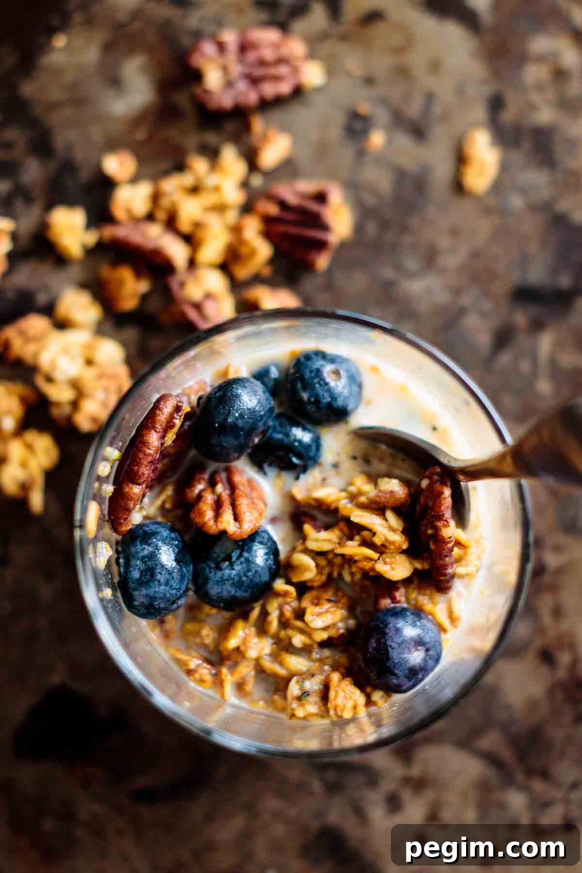 Granola served with blueberries and almond milk.