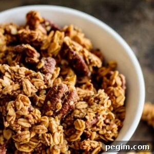 a with bowl of baked pumpkin spice granola